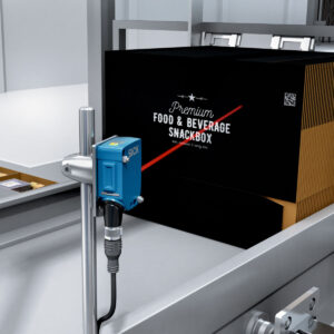 A SICK DT50 distance sensor measures carton fill levels