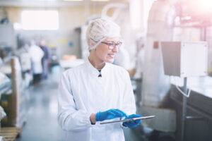 bigstock Smiley Female Worker In Steril 310384978 1